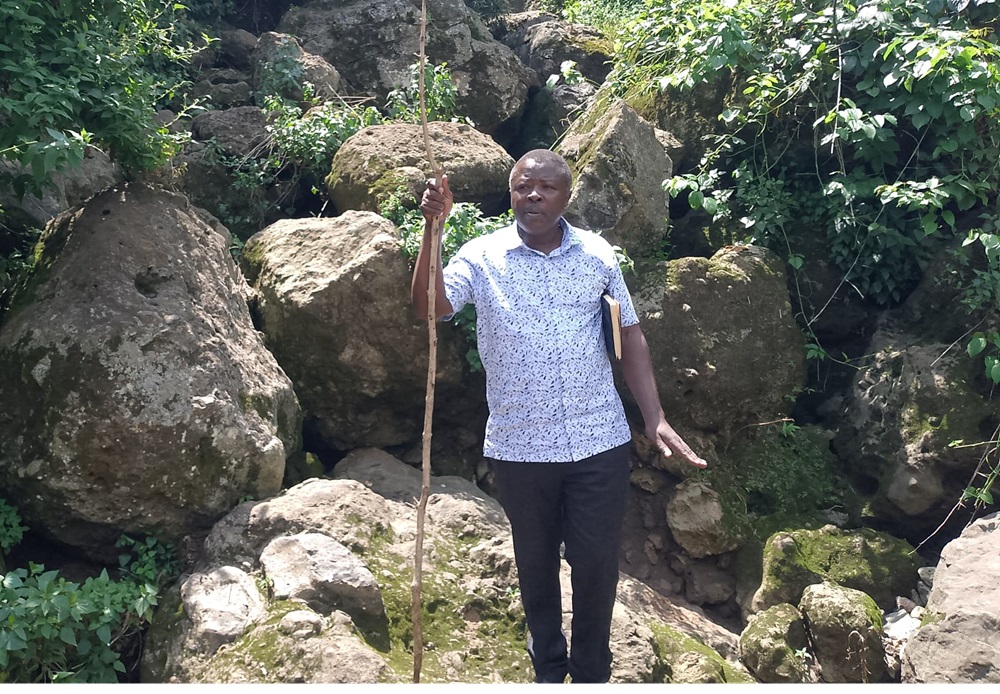 Bugisu Cultural Institution spokesperson Steven Masiga at Taraja ya Mungu (God's Bridge), a unique tourism attraction located along the Uganda-Kenya border.